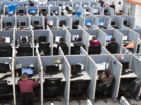 People sit on chairs in an office